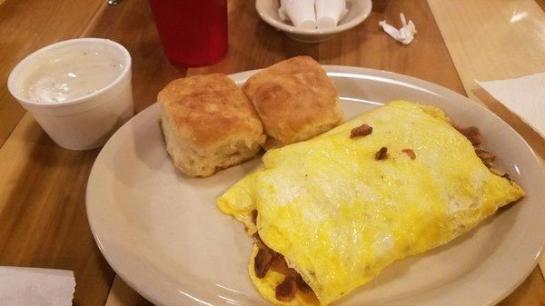 C 3 egg omelette loaded with at least 4 pieces of bacon and your choice of toast or biscuits and gravy come on u have better way 2 spend $7