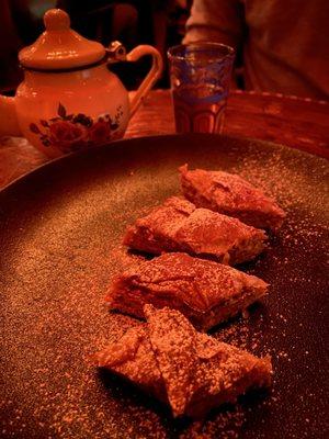 Green mint tea served in "authentic" real North African tea pot. And delicious delicate baklava