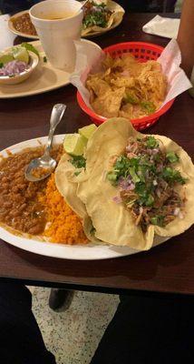 Carnitas Taco and carne Asada Taco with rice and beans