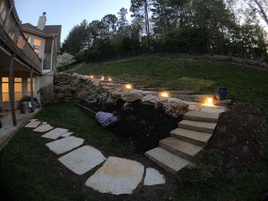 Suburbia replaced our walkway, down the hillside and from there to the lower patio.  The lighting makes the back yard so inviting!