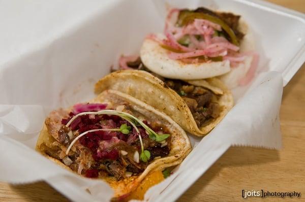 tamarind duck taco with toasted almond and pickled beet salad