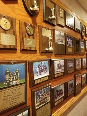 Trophy wall near restrooms, by the entrance.