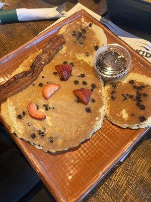 Chocolate chip Mickey Mouse pancake with bacon.