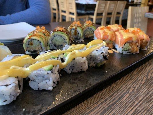 Bottom left clockwise: New York Roll, Dragon Roll, Salmon Family Roll