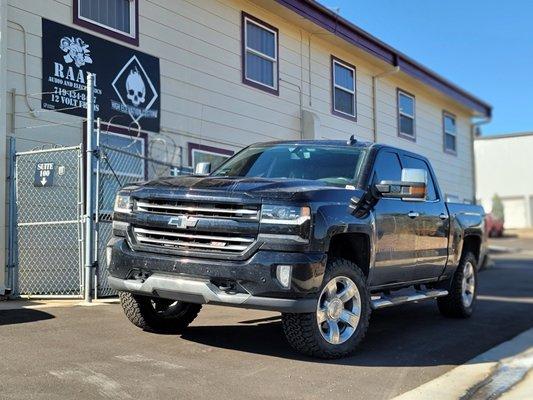 2016 Chevy Silverado 1500 had a set of Front Vertex adjustable coil-overs with rear shocks installed from Rough Country.