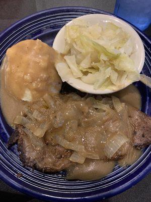 Liver and onions, mashed potatoes and gravy, steamed gabbage.