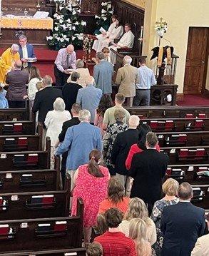 Worshipers waiting to receive communion