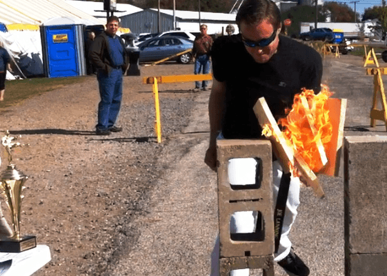 Instructor Lanning breaking boards set on fire at a demonstration at the Westville Pumpkun Festival, Sept. 12.