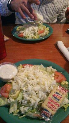 Fresh salad,  comes with your dinner.  Homemade dressing and they make their mozzarella cheese.