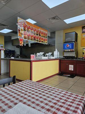 Loud overhead grill vent and very loud ice machine above the soda machine.