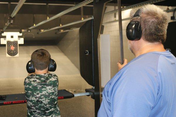 Father and Son on Range at Second Amendment Sports