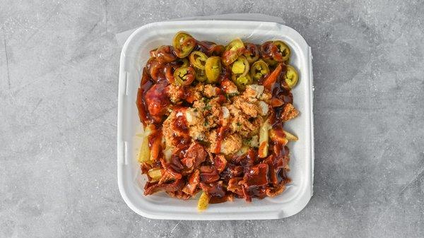 LOADED STICKY FRIES -Fries topped with deep fried chicken breast and our homemade ranch and buffalo sauce.