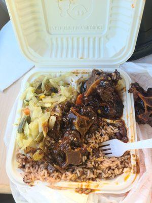 Ox tail stew w/ rice n peas and cabbage. I had already had a few bites before taking the pic.