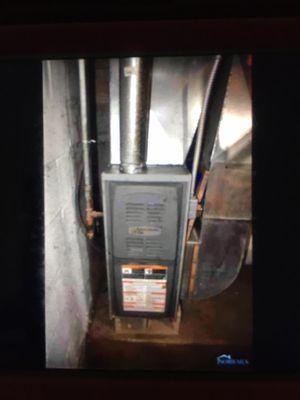 This furnace is not new it's old and rusty inside and the garage the back of the concrete is not level