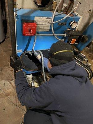 Roy Galloway (Briggs Mechanical) cleaning out my extremely dirty 2 year old furnace.