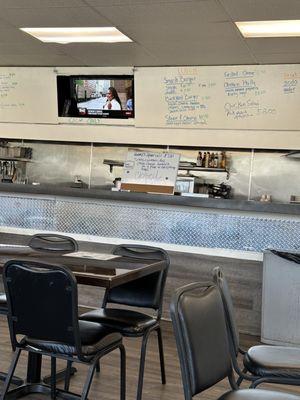 There is a diner inside the auto mechanic shop!