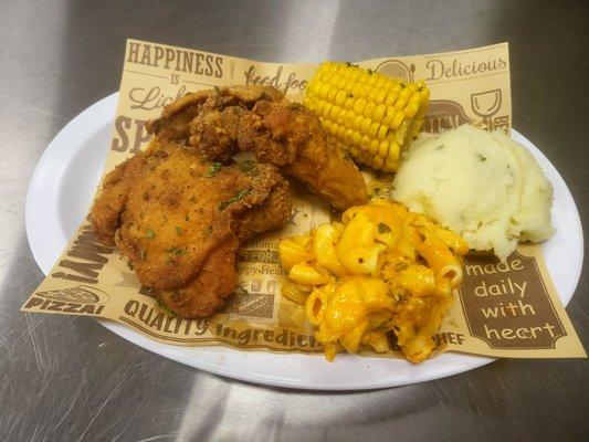 2 pc fried chicken dinner with baked mac n cheese, mashed potatoes and corn on the cobb