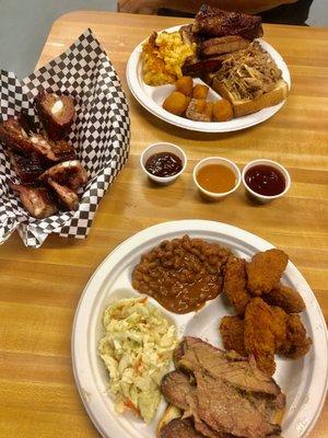 Rib tips appetizer and two combos - beef brisket and chicken wings (with coleslaw and baked bean sides) and ribs and pulled pork.