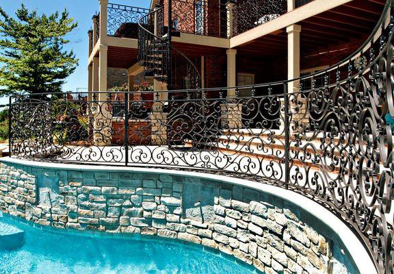 Custom metal railing around pool from http://theheckcompany.com