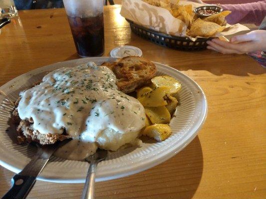 Chicken Fried Steak with mashed potatoes and seasonal squash.