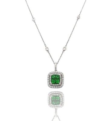 Rare, cushion-shaped Tsavorite garnet and diamond pendant.