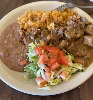 Mexican Lunch -114oz of carne guisada, spanish rice, refried beans, salad, and tortilla.