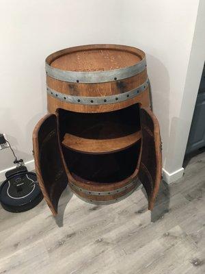 Recycled wine barrel liquor cabinet