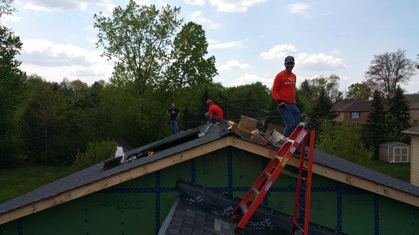 Anthony, Dan, and Cherif finishing up the installation on the roof.