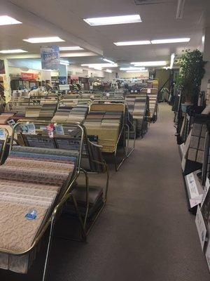 Great room of discounted "remnants" of carpet in Back! Super organized!