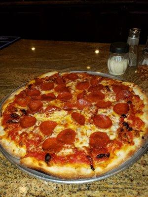 Pepperoni and sun dried tomatoes pizza