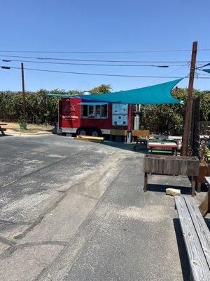 Taco truck, there's of seating next to it