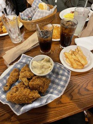 Southern fried chicken with French fries and dumplins.