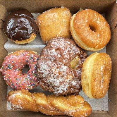 Boston Cream, Black Raspberry filled Glazed, Glazed, Apple Fritter, Strawberry Sprinkled, and Twist Donuts!