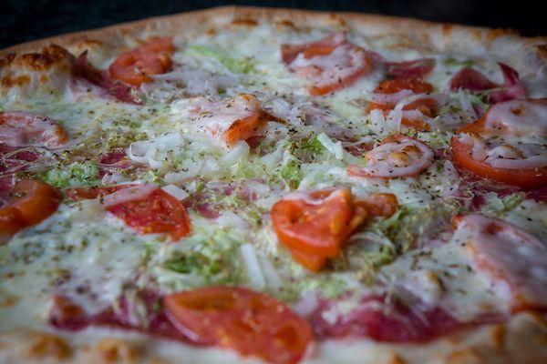 Italian Style Pizza, one of a kind, must-try pizza at Nikoli's. Like Italian sub? Watch us make it a pizza