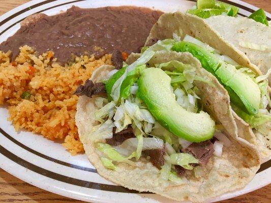 3 Beef tacos with yellow rice and refined beans