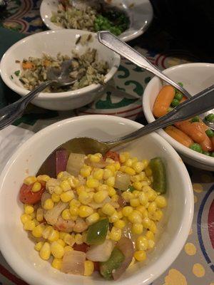 3 sides included with dinner. Corn, peas & carrots & wild rice.