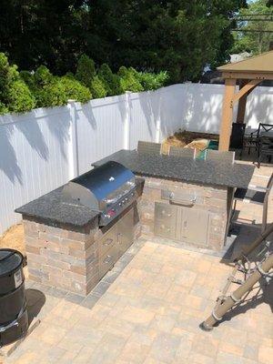 We love working outside on projects like this steel grey granite BBQ! It really brings this backyard set up together and screams summer!