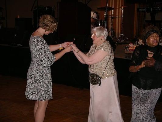 Marcella teaches LBFE program coordinator Amy a few moves on the dance floor