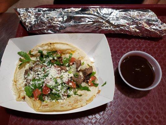 Steak taco and churro with chocolate sauce