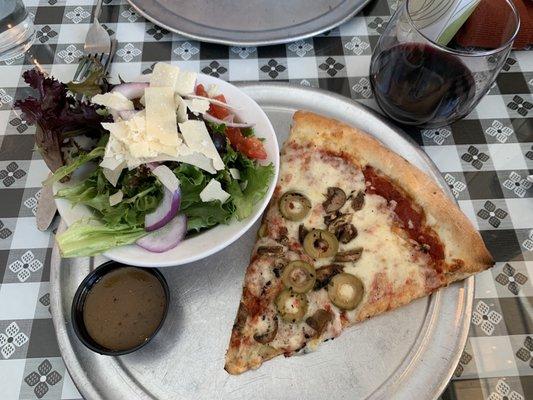 Slice of mushroom and green olive with a side salad