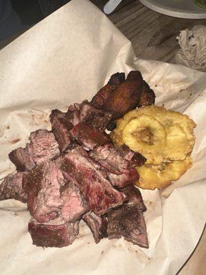 Carne en vara w tostones and platanos maduros