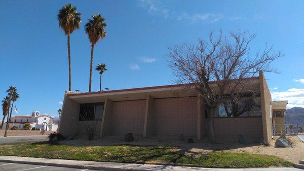 This is a view of the library from its parking lot.  Its front facade is stucco and looks different from this side.