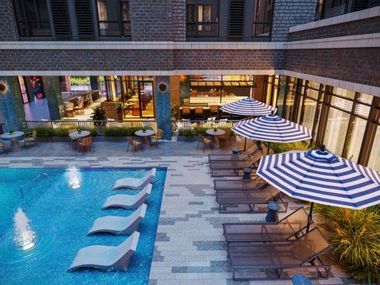 Resort Style sparkling pool with sun shelf and neighboring hotel bar