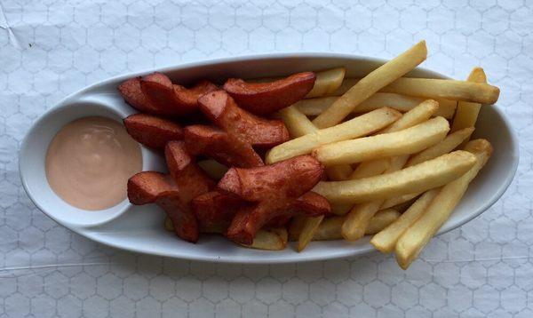 Salchipapa. Sliced hot dog and french fries