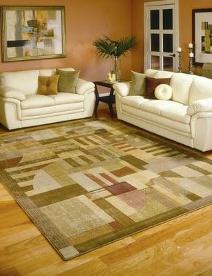 This area rugs really ties in the sofa with the accent pillows and offers a great contrast with the floors