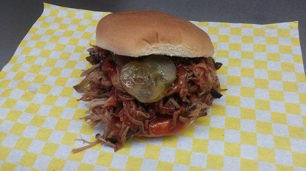 Pulled Pork Sandwich pickles and mild BBQ sauce