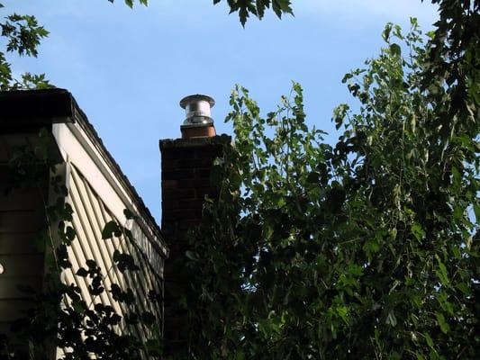 Chimney liner termination top cap on 2 story chimney.