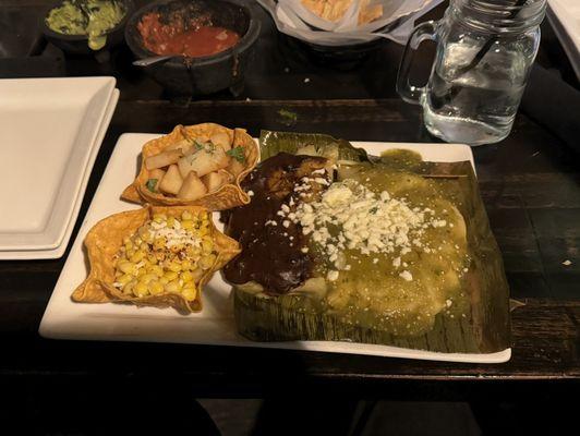 Lime potatoes, esquites, chicken tamale with mole, pork tamale with chile verde. Tamales were dry despite sauce on top.