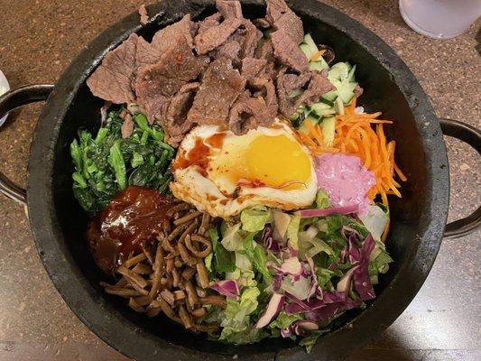 Bulgogi Beef Bibimbap cooked in hot stone.