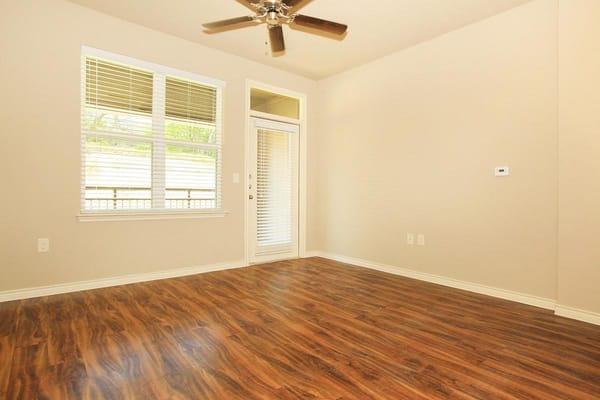 Spacious living area with wood-like flooring throughout!